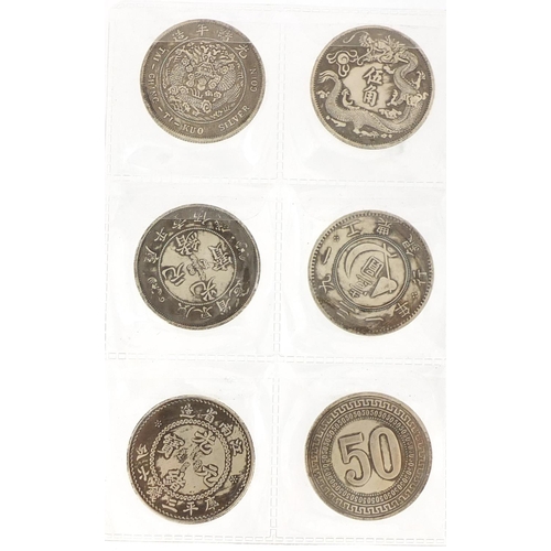 654 - Thirty Chinese silver coloured coins, each 3.5cm in diameter, approximate weight 396.0g