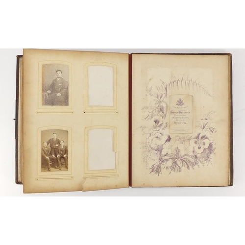 858 - Victorian leather bound photograph album with black and white cabinet cards and photographs, 30cm hi... 