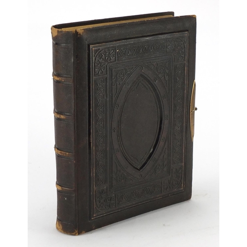 857 - Victorian leather bound photograph album, the pages decorated with roses, 30cm high