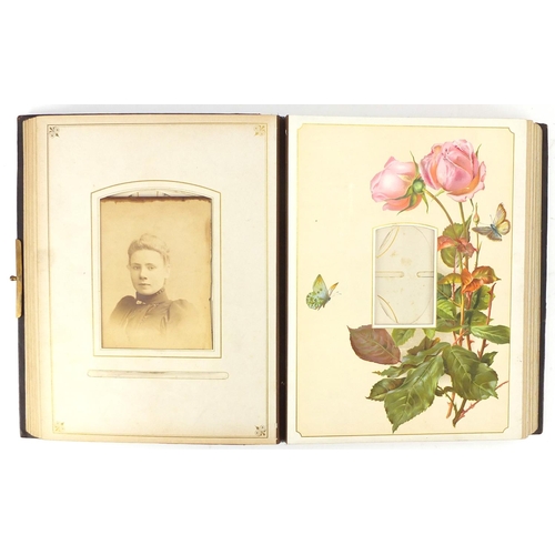 857 - Victorian leather bound photograph album, the pages decorated with roses, 30cm high