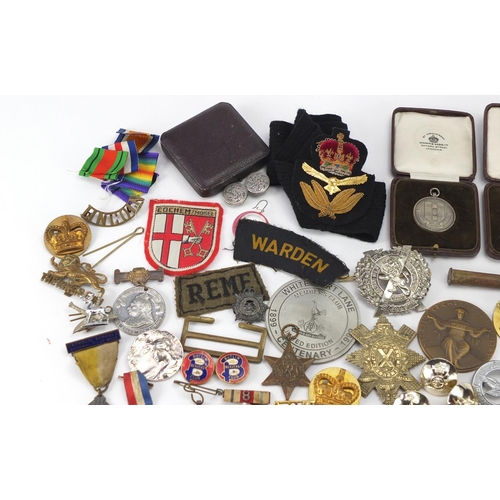 896 - Objects including Military cap badges, pips and vintage badges