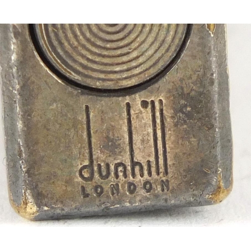 670 - Dunhill silver plated pocket lighter with engine turned decoration, 6cm high