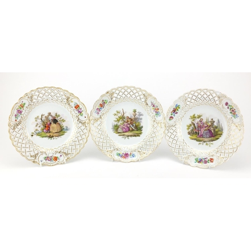 711 - Three Meissen porcelain plates with pierced borders, each hand painted with flowers and lovers, each... 