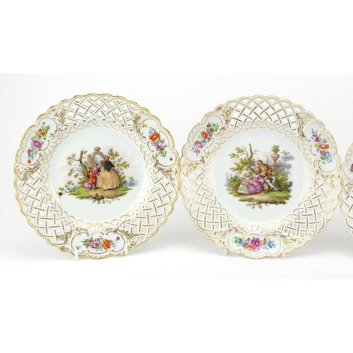 711 - Three Meissen porcelain plates with pierced borders, each hand painted with flowers and lovers, each... 