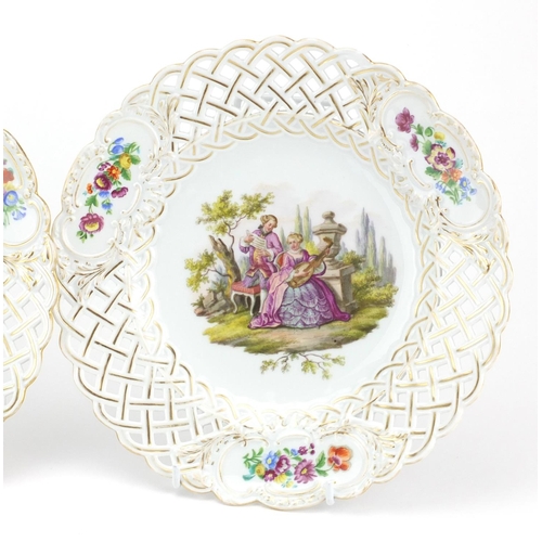711 - Three Meissen porcelain plates with pierced borders, each hand painted with flowers and lovers, each... 