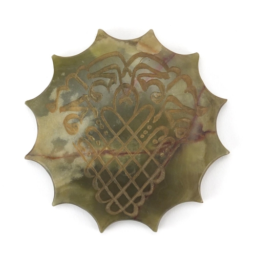 609 - Islamic green hardstone carved with script, 10.5cm in diameter