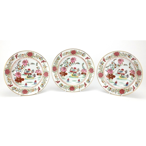 438 - Three Chinese porcelain shallow dishes, each hand painted in the famille rose palette with ducks in ... 