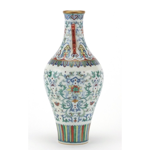 384 - Chinese porcelain doucai vase with iron red handles, finely hand painted with flower heads amongst f... 