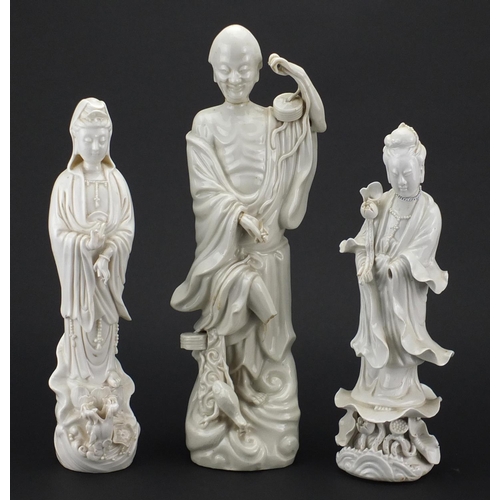 495 - Two Chinese blanc de chine of Guanyin and an example of a monk, the largest 38cm high
