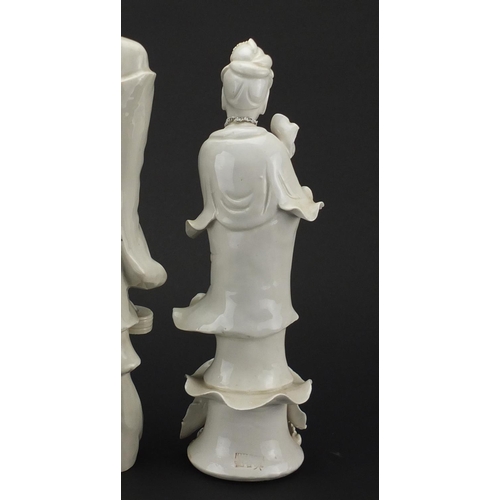 495 - Two Chinese blanc de chine of Guanyin and an example of a monk, the largest 38cm high