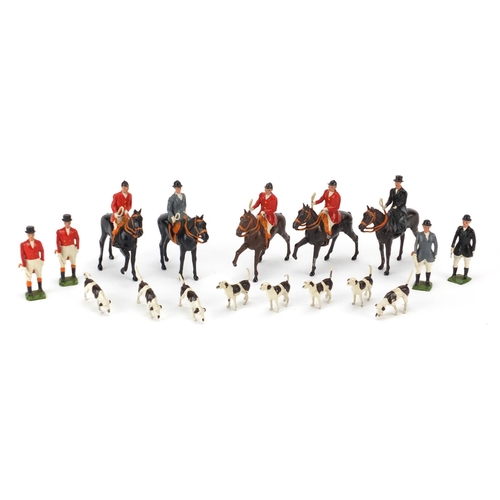 151 - Britains hand painted lead huntsmen, horses and hounds, the largest 8cm high
