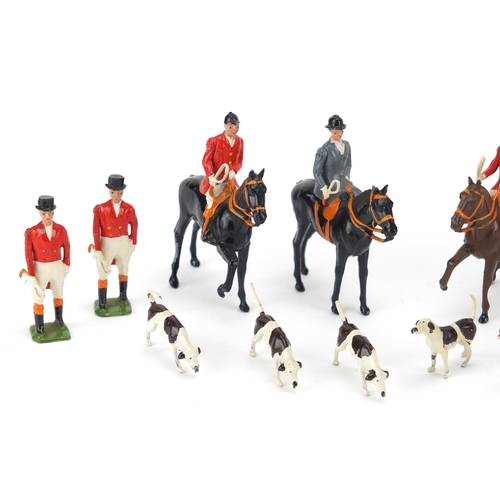 151 - Britains hand painted lead huntsmen, horses and hounds, the largest 8cm high