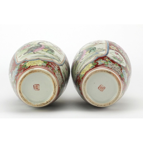 509 - Pair of Japanese porcelain vases, hand painted with geese, trees and flowers, character marks to the... 