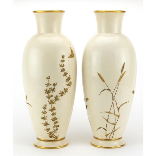 758 - Pair of Royal Worcester aesthetic porcelain vases, gilded with butterflies above flowers and ferns, ... 