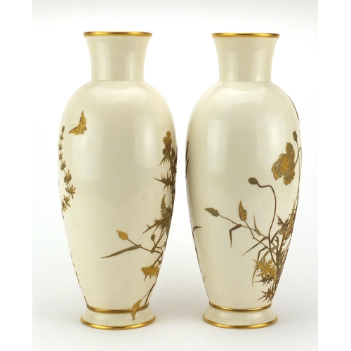 758 - Pair of Royal Worcester aesthetic porcelain vases, gilded with butterflies above flowers and ferns, ... 