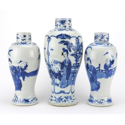 472 - Three Chinese blue and white porcelain baluster vases including a pair, each hand painted with figur... 