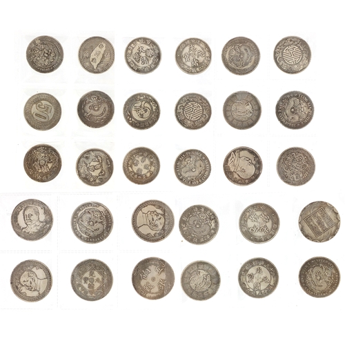 654 - Thirty Chinese silver coloured coins, each 3.5cm in diameter, approximate weight 396.0g