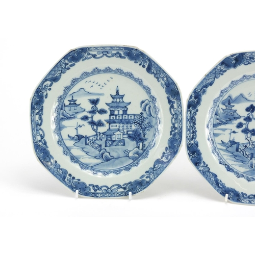 2423 - Pair of Chinese blue and white porcelain plates, hand painted with river landscapes, each 23cm in di... 