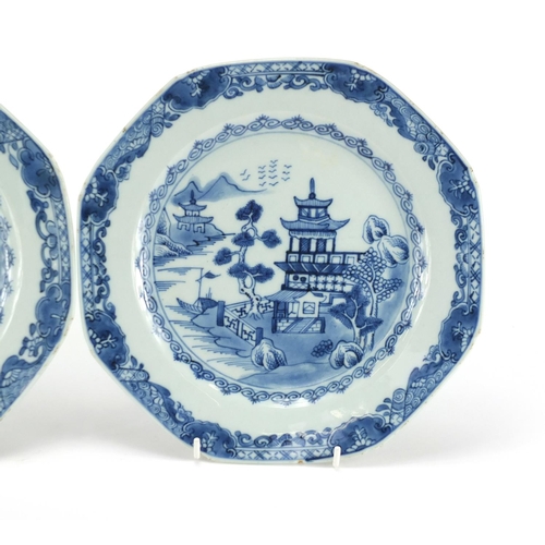 2423 - Pair of Chinese blue and white porcelain plates, hand painted with river landscapes, each 23cm in di... 