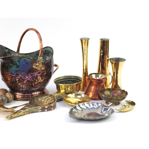 309 - Copper and brassware including a Victorian helmet shaped coal scuttle, fire bellows, vases, onyx egg... 