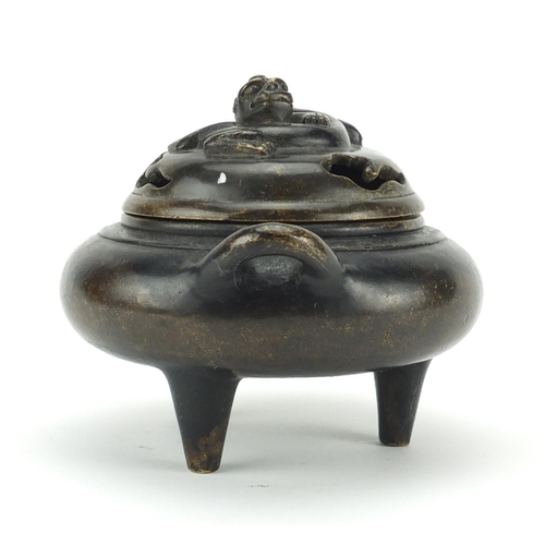 564 - Chinese patinated bronze tripod incense burner and cover with twin handles, character marks to the b... 