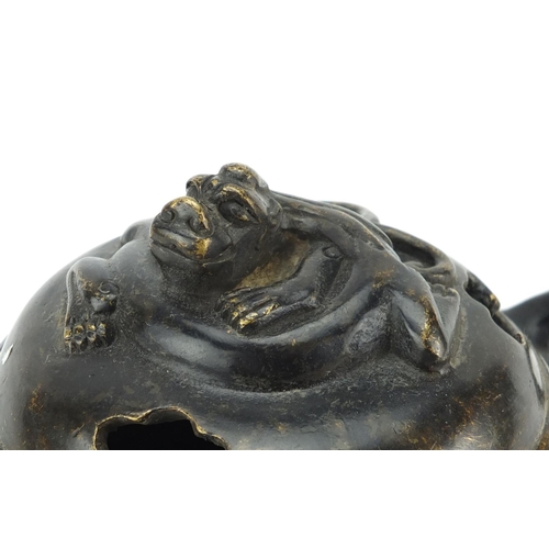 564 - Chinese patinated bronze tripod incense burner and cover with twin handles, character marks to the b... 