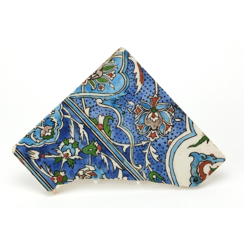 613 - Islamic Iznik pottery tile fragment, hand painted with flower heads and stylised foliage, 20cm x 20c... 