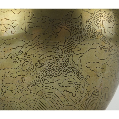 567 - Chinese bronze double gourd vase, engraved with dragons chasing the flaming pearl amongst clouds, ch... 