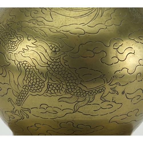 567 - Chinese bronze double gourd vase, engraved with dragons chasing the flaming pearl amongst clouds, ch... 