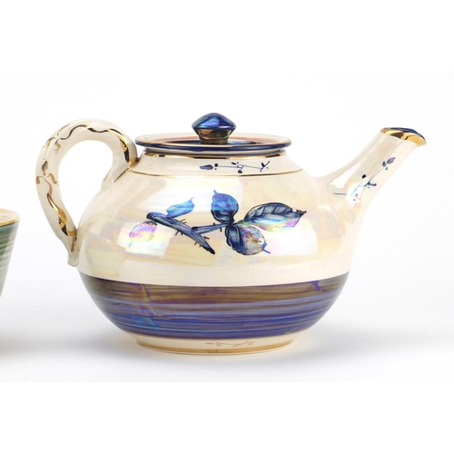 787 - Alvin F Irving lustreware studio ceramics comprising a teapot and two bowls, hand painted with leafs... 