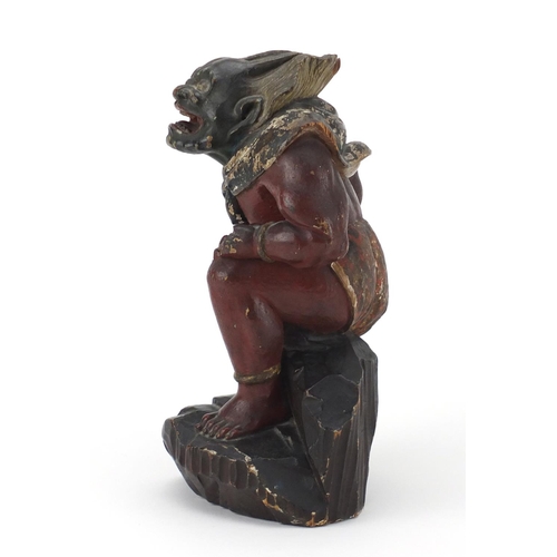 585 - Chinese lacquered wood carving of a warrior, 25.5cm high