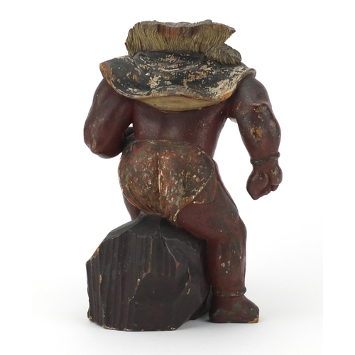 585 - Chinese lacquered wood carving of a warrior, 25.5cm high