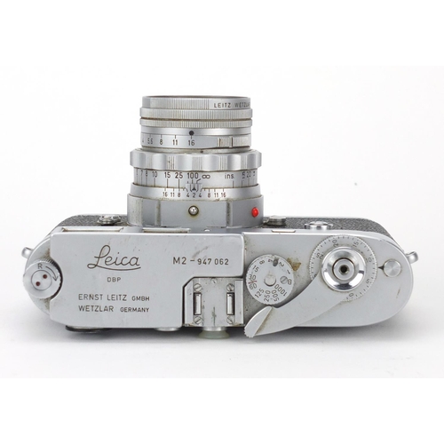84 - Ernet Leitz Leica M2 camera outfit with lenses and accessories comprising M2 camera body, serial num... 