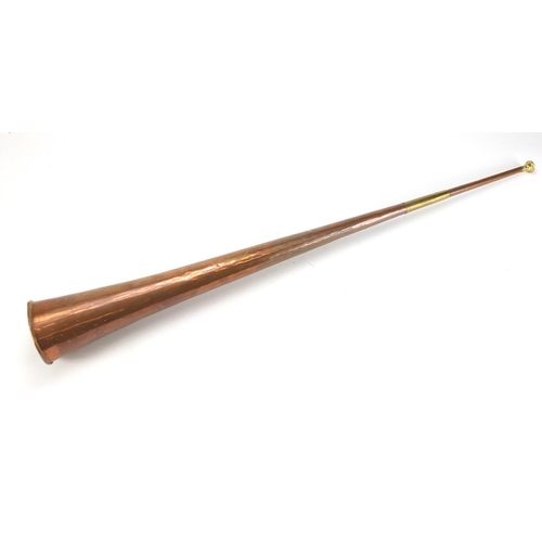 261 - Copper and brass hunting horn, 91cm in length