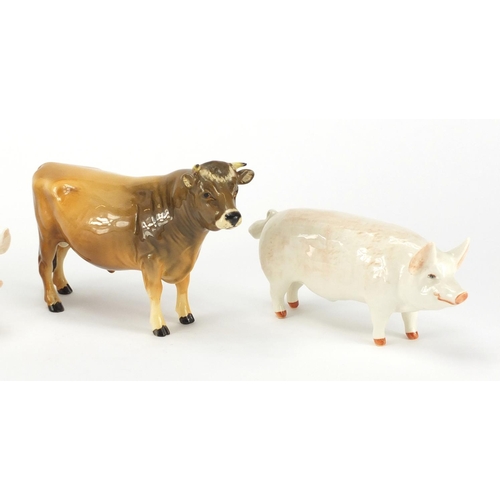 2563 - Two Beswick Champion pigs and a Champion Coy Boy Jersey Cow, the largest 11cm high