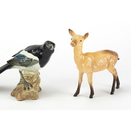 2562 - Three Beswick animals comprising a goat, deer and magpie, numbered 2305, the largest 15.5cm high