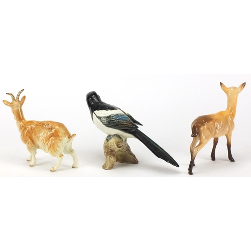 2562 - Three Beswick animals comprising a goat, deer and magpie, numbered 2305, the largest 15.5cm high