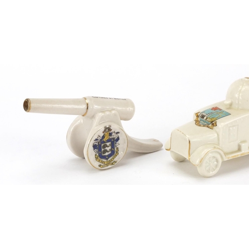2384 - Three pieces of crested china comprising a model of armoured car by Shelley china, German gun captur... 