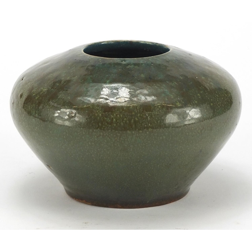 765 - Mortlake green glazed pottery squatted vase by George J Cox, incised marks to the base, 9.5cm high