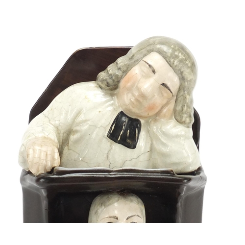 687 - Victorian Staffordshire pottery group of a sleeping judge and a clerk, 24.5cm high