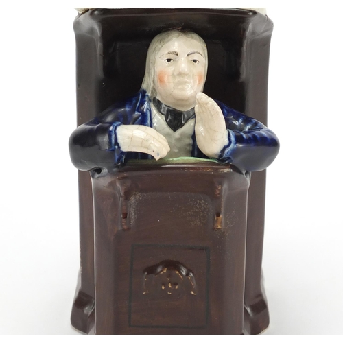 687 - Victorian Staffordshire pottery group of a sleeping judge and a clerk, 24.5cm high