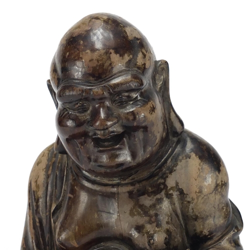 584 - Chinese hardwood carving of seated Buddha, 29cm high