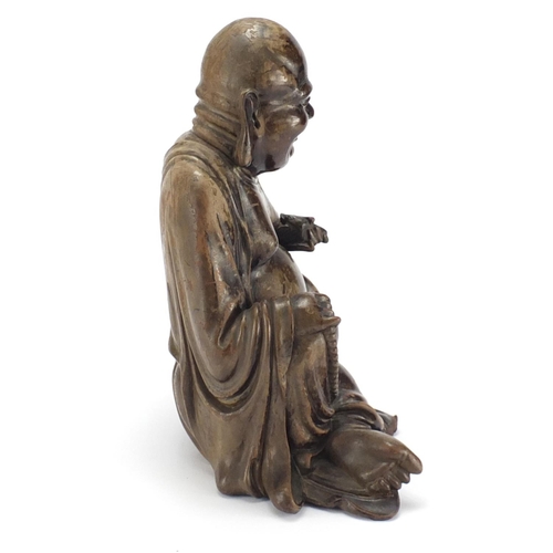 584 - Chinese hardwood carving of seated Buddha, 29cm high