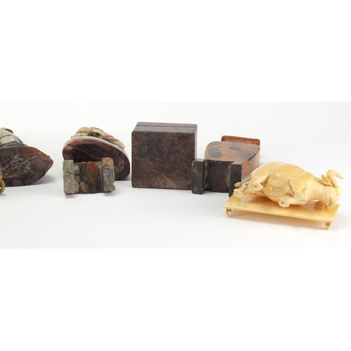 559 - Chinese carved ivory water buffalo and a group of soapstone including a puzzle housed in a box, twin... 