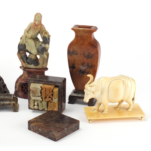 559 - Chinese carved ivory water buffalo and a group of soapstone including a puzzle housed in a box, twin... 