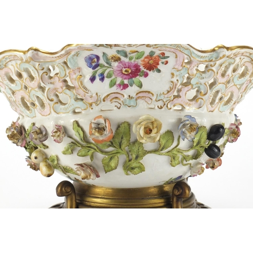 715 - 19th century porcelain floral encrusted centre piece, hand painted with flowers raised on a bronze f... 