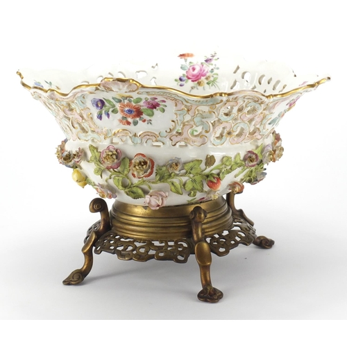 715 - 19th century porcelain floral encrusted centre piece, hand painted with flowers raised on a bronze f... 
