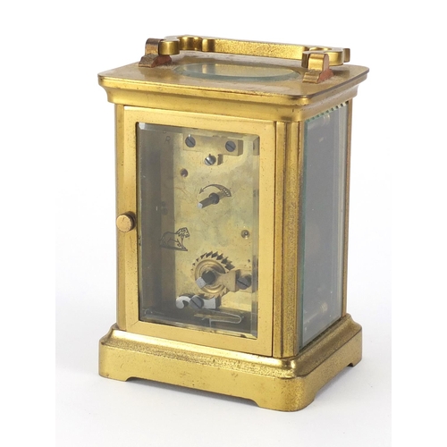 2346 - Brass cased carriage clock with enamelled dial and Roman numerals, 11cm high
