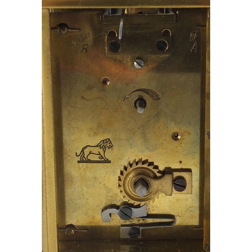 2346 - Brass cased carriage clock with enamelled dial and Roman numerals, 11cm high