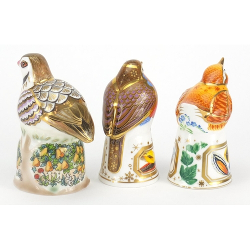 2601 - Three Royal Worcester bird candle snuffers comprising a partridge in a pear tree, robin and wren, th... 